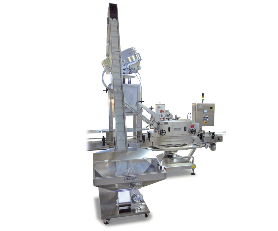 MACHINE SUITABLE FOR CLOSING  GLASS CONTAINERS PRESS-ON PLASTIC COVERS.